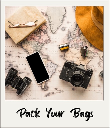Polaroid with the world map, a camera, phone, binoculars, and other various packing essentials with "Pack Your Bags" written on it.
