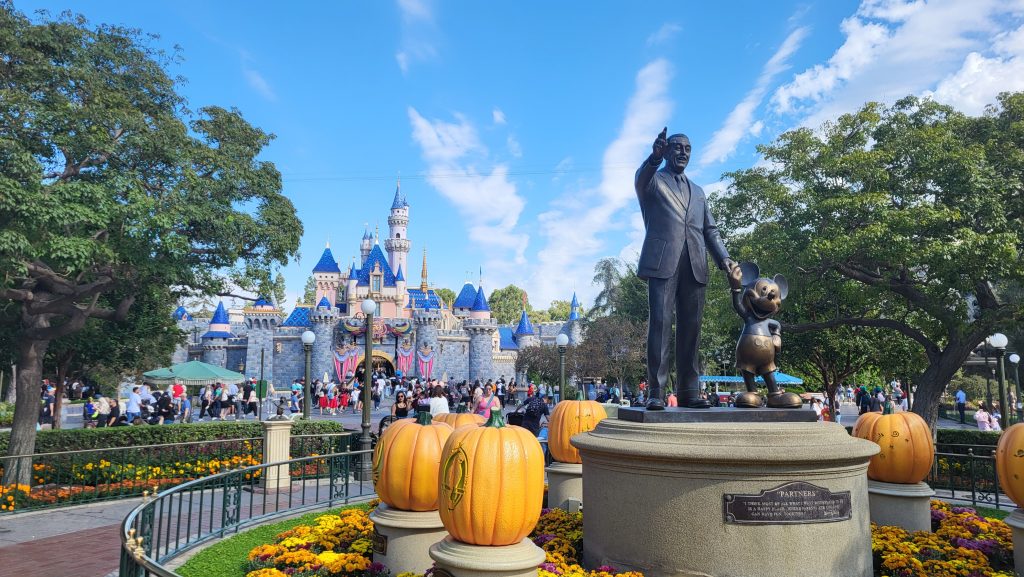 Cinderella's Castle at Disneyland Theme Park at Halloween Time with Walt Disney and Mickey Mouse Statue